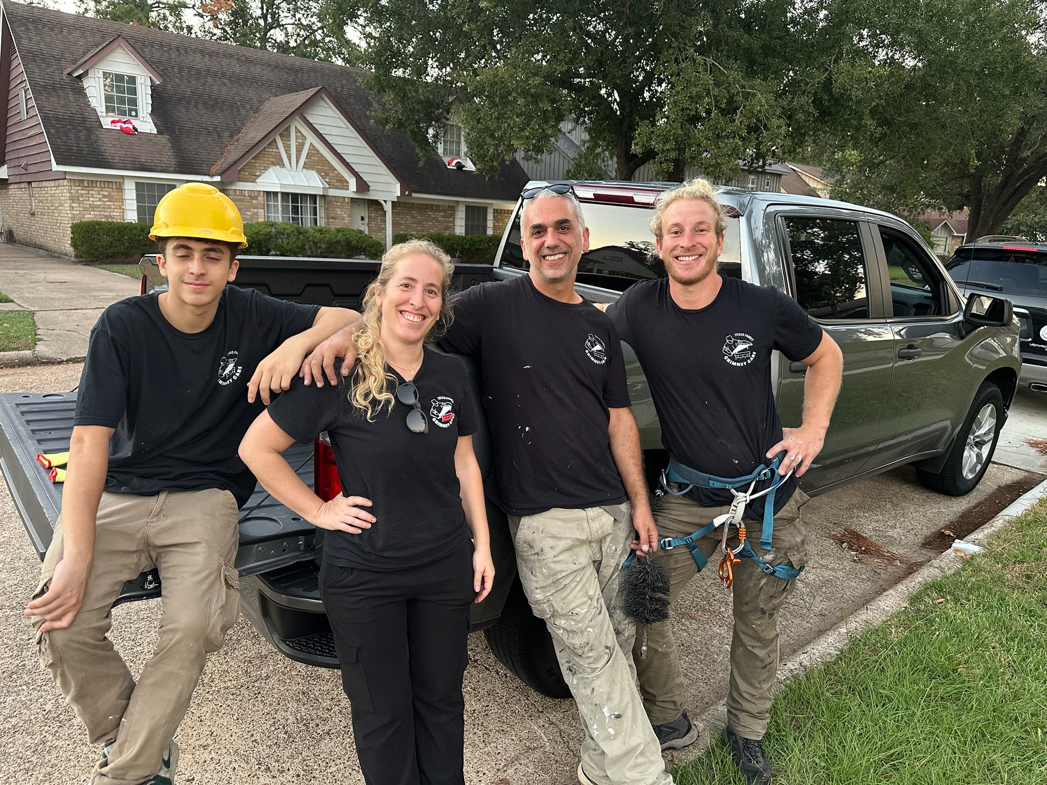 The Texas Family Chimney Care crew, including owner Michal, in front of the company truck in Houston