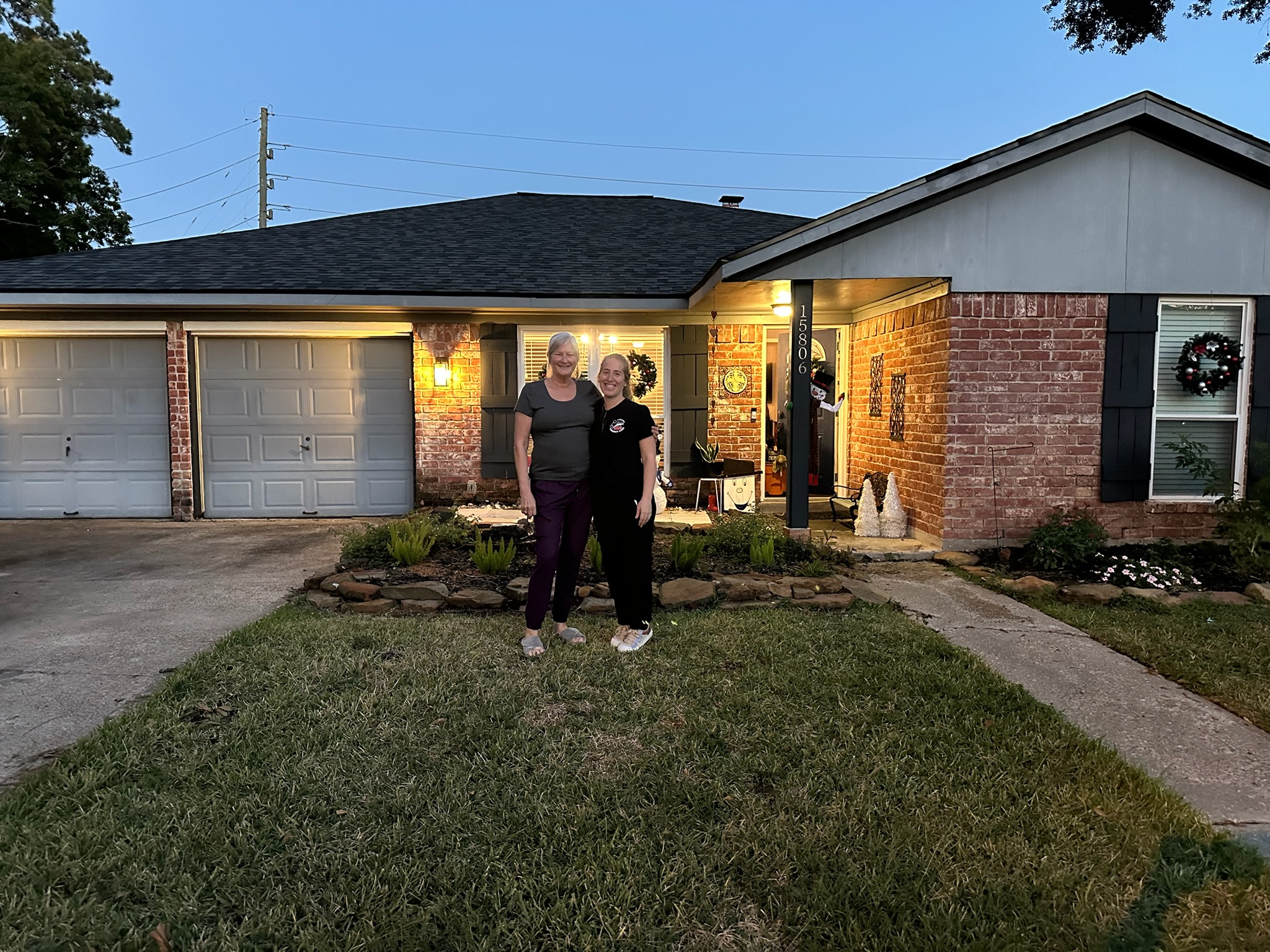 Mary and the Texas Family Chimney Care technician outside her Houston home after her chimney inspection