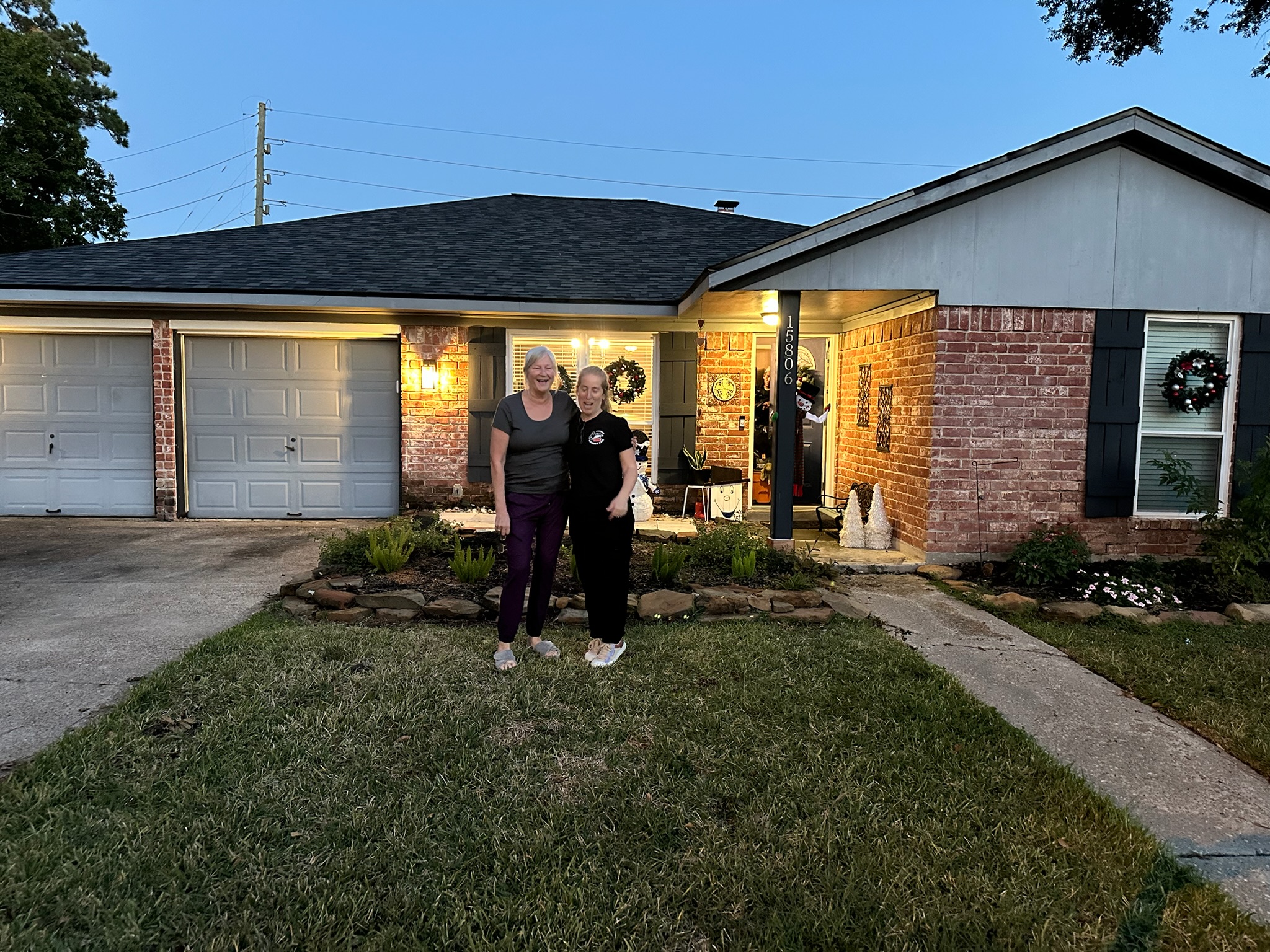Mary and the Texas Family Chimney Care team laughing together outside her Houston home